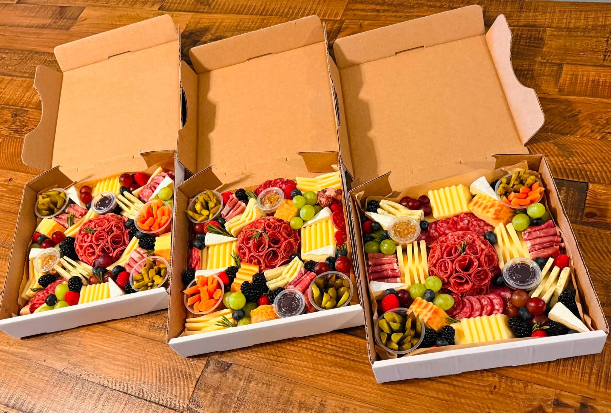 A selection of Rustic Box charcuterie boxes prepared for a larger order