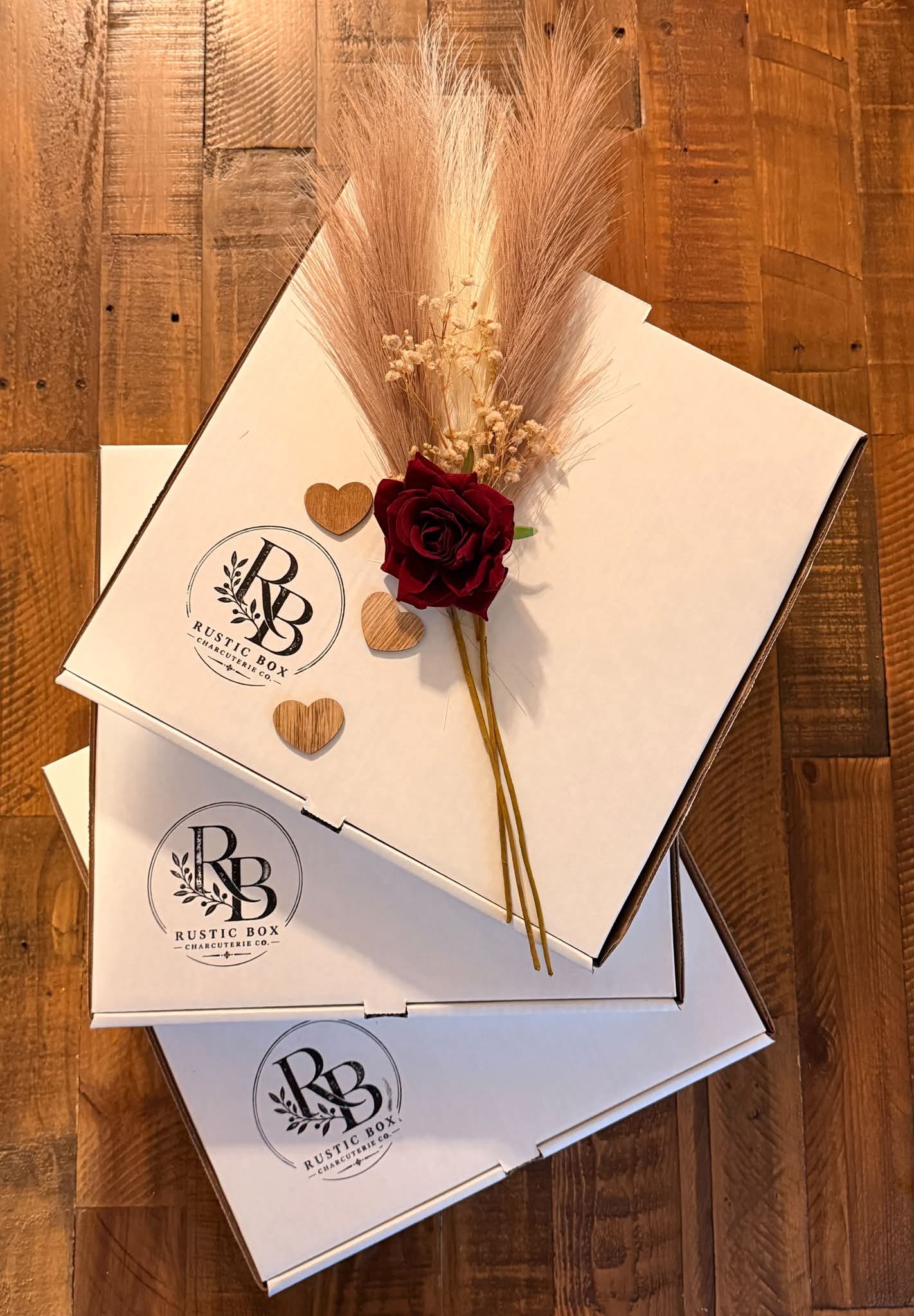 Rustic Box packaging finished with the RB monogram and dried floral details