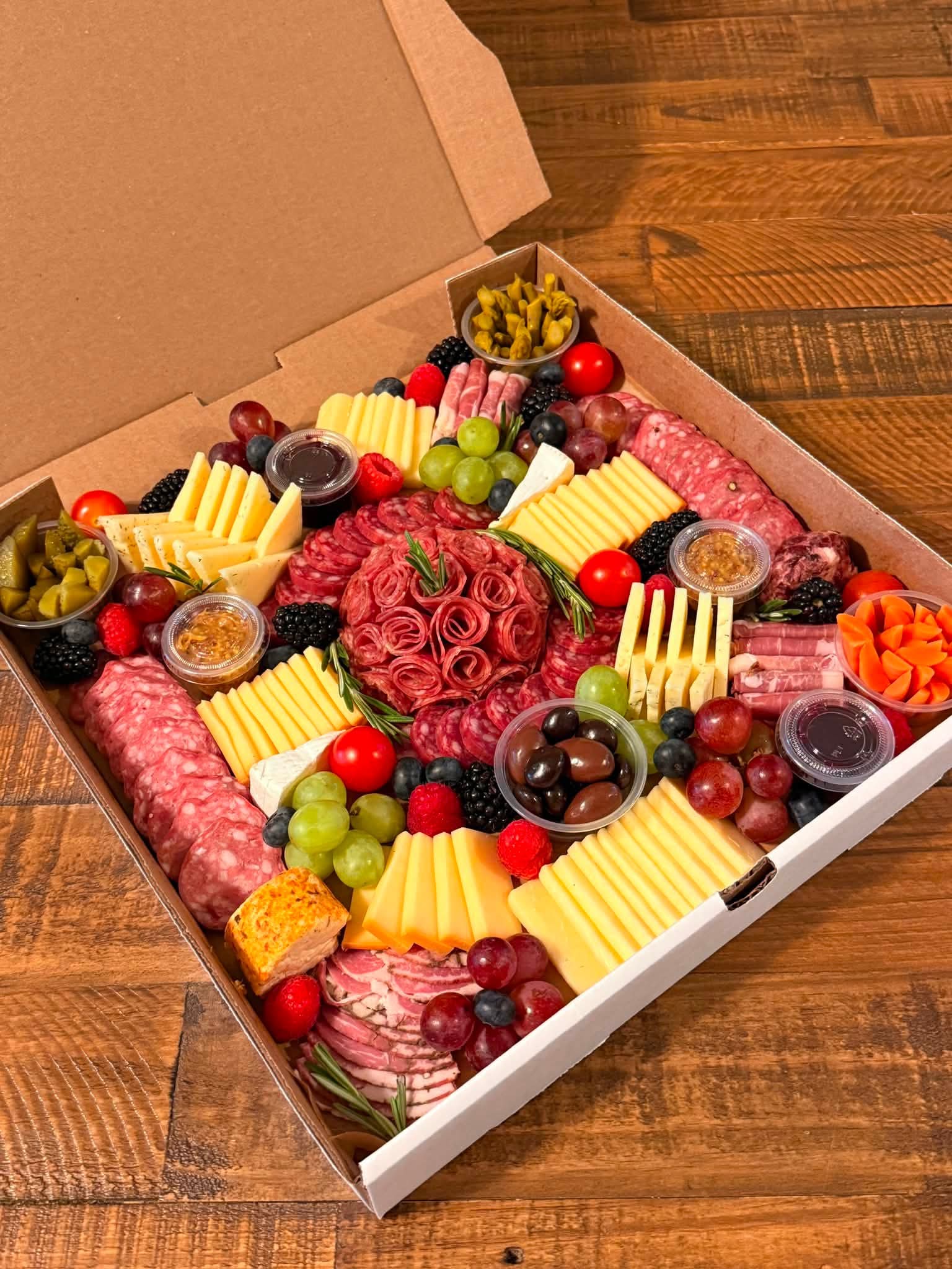 Rustic Box artisan charcuterie on a wooden table